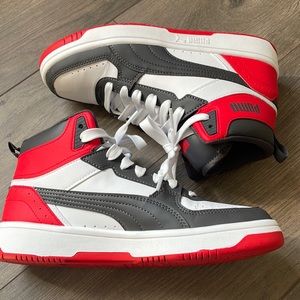 Red, white and grey Puma high tops